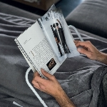 Support de lecture, utilisation dans un lit