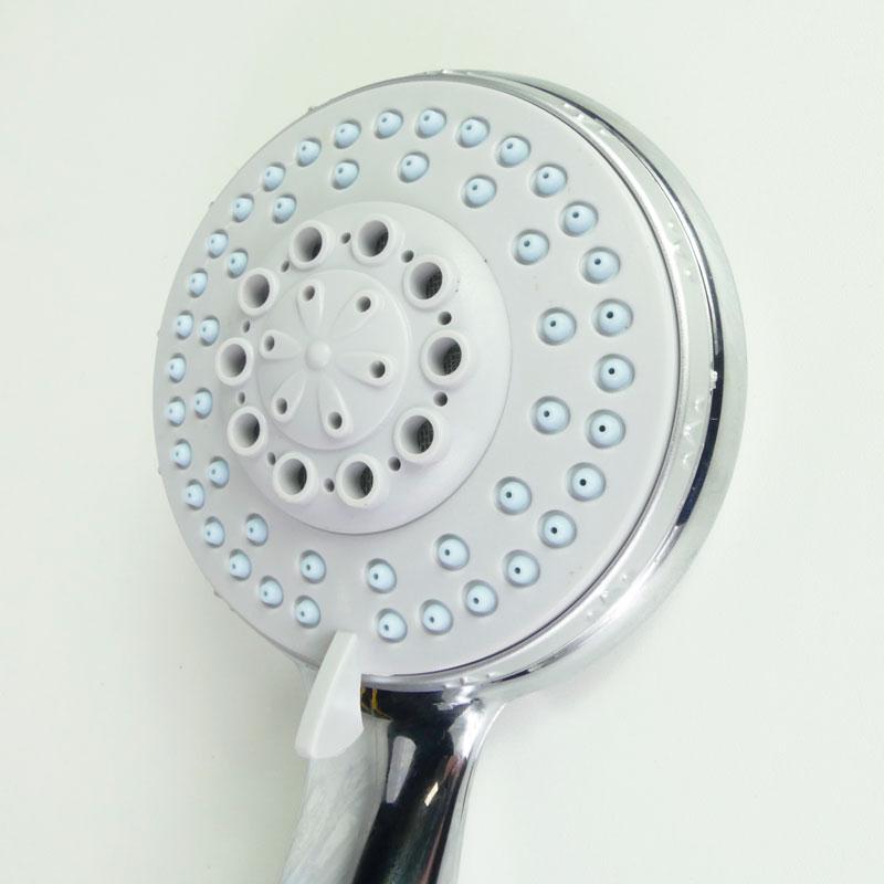 Safety shower head with stop button