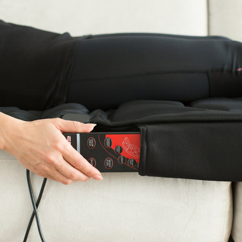 Matelas de massage avec une pochette de rangement pour la télécommande