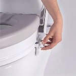 Réglage de la molette de fixation de la réhausse WC Ibiza Soft 15 cm sur des toilettes - réf. 811074