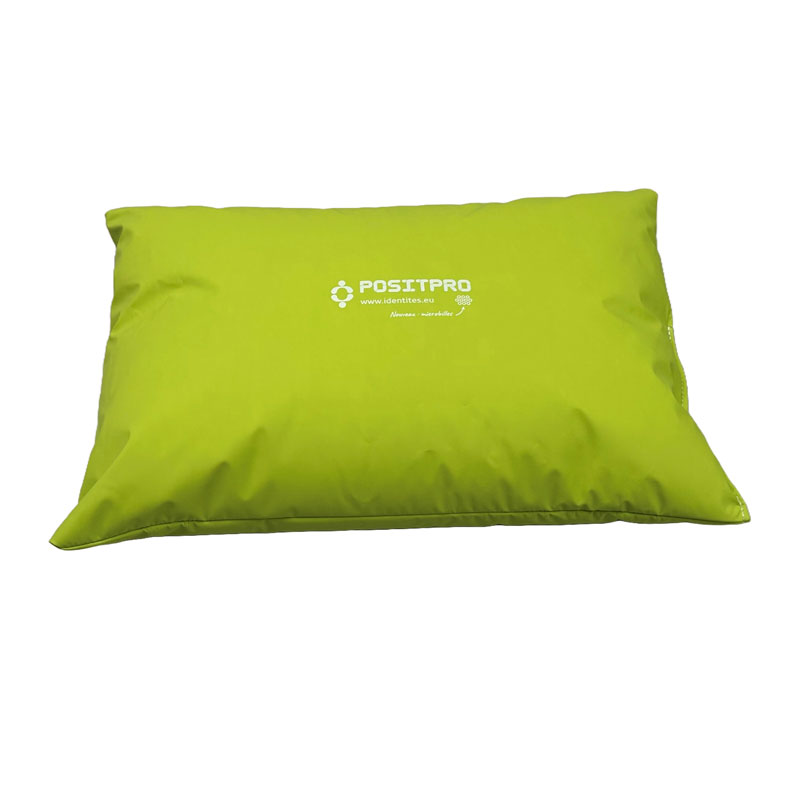 Coussin universel pour le positionnement au lit